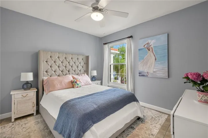 Bedroom featuring baseboards and ceiling fan