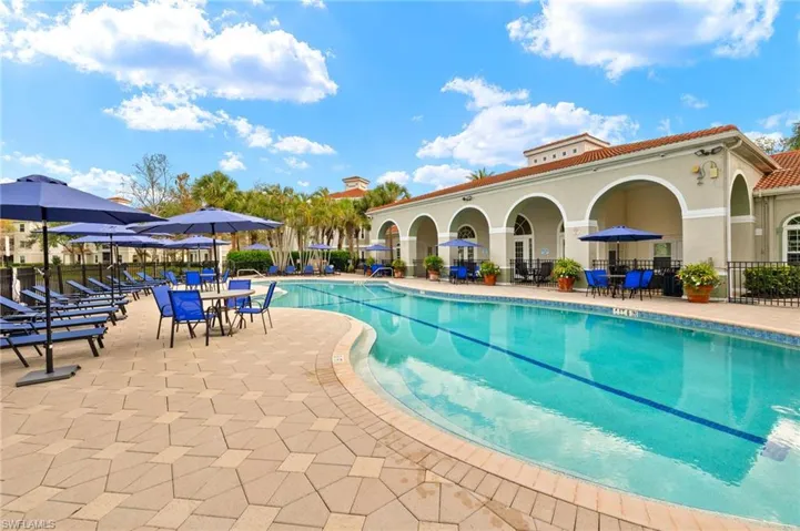 Community pool with a patio