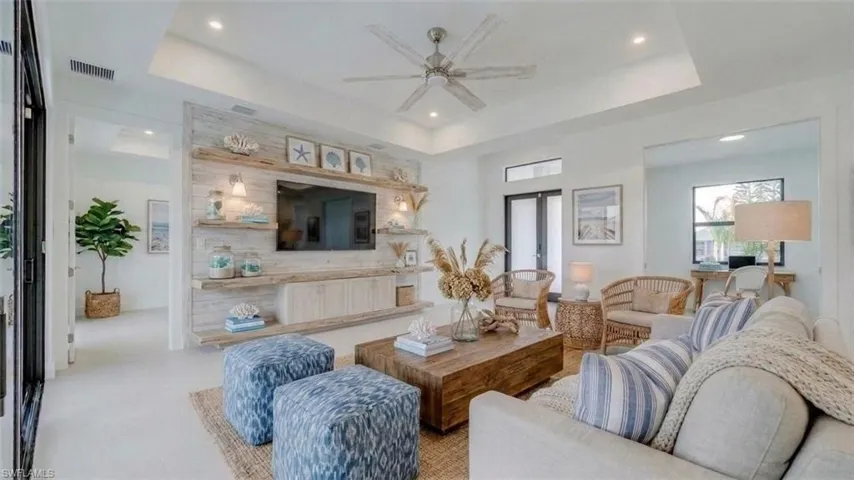 Great room showing double door foyer entrance, office/den to the right. Virtually staged & enhanced.