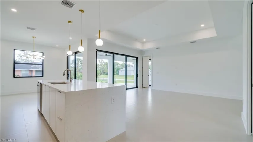 High ceilings throughout with trey ceiling and custom lighting.