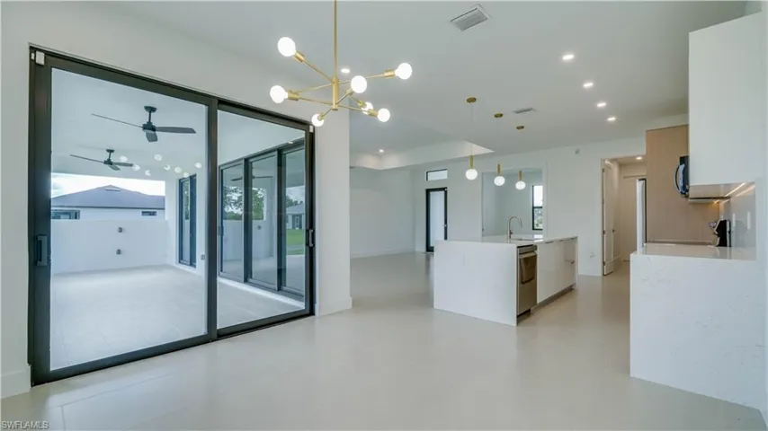 View from dining area with another set of 8' sliding doors to the lanai. Beautiful open floor plan.
