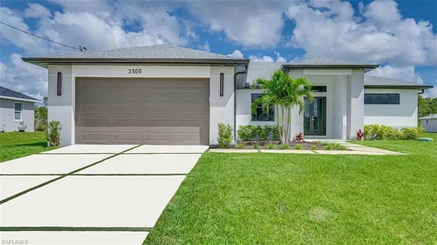 Welcome to 3500 13th St. W! Note the grassed laced designer driveway! Photo virtually enhanced.
