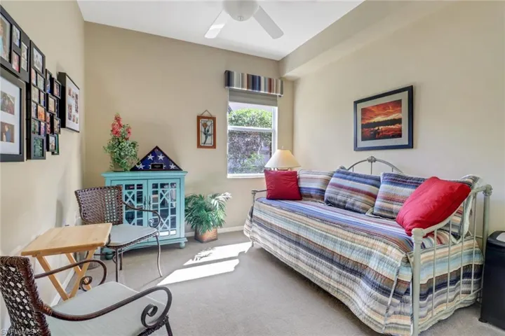 Bedroom with ceiling fan and carpet floors