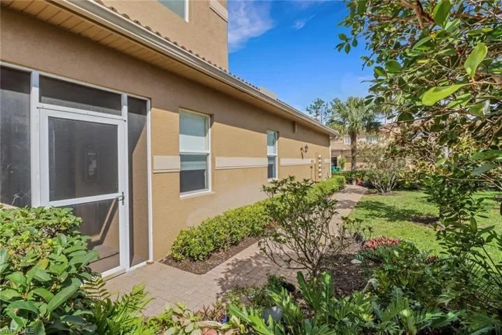 View of side of home with a patio area