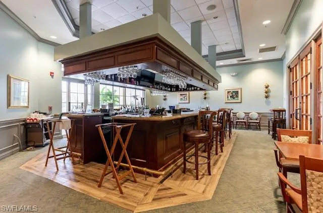 Bar featuring crown molding