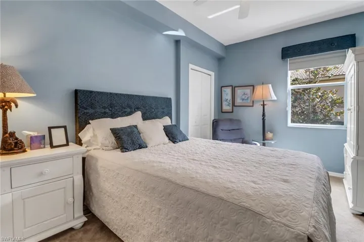 Bedroom featuring carpet, ceiling fan, and a closet