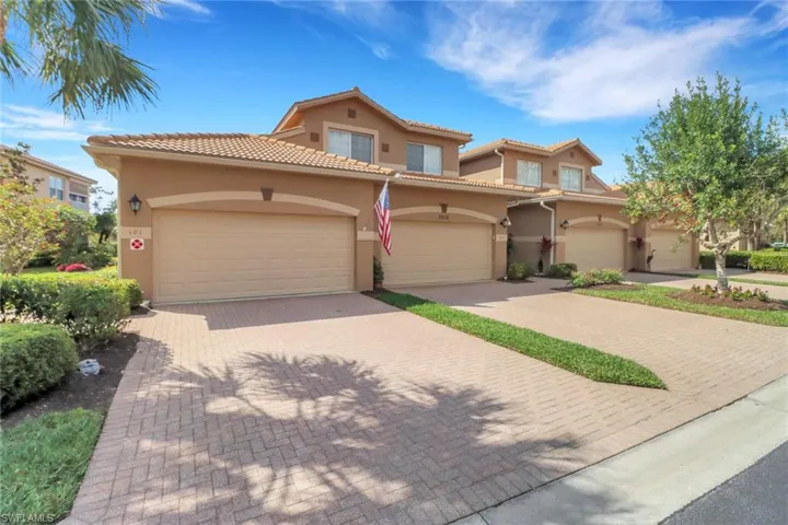 Mediterranean / spanish-style house with a garage