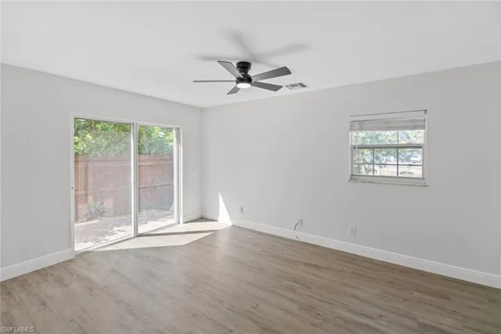 Unfurnished room with ceiling fan and light wood-style floors