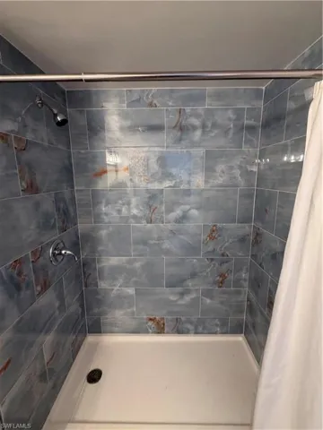 Full bathroom with a stall shower