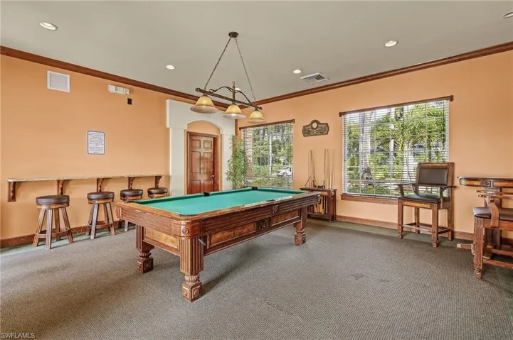 Rec room with ornamental molding, recessed lighting, and billiards table