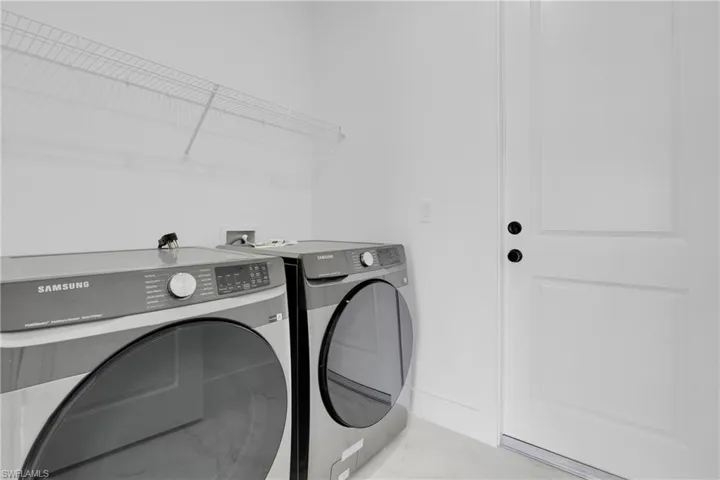 Laundry room featuring separate washer and dryer