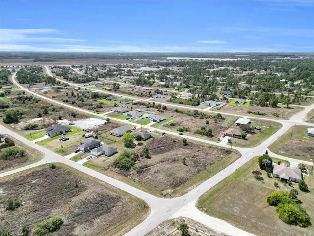 View of property location with nearby suburban area