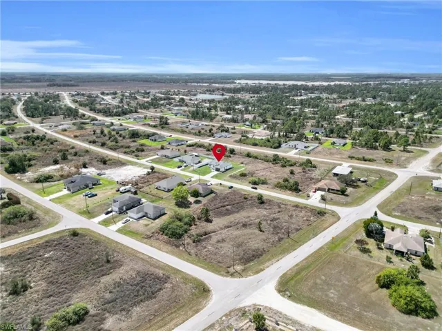 Aerial overview of property's location with nearby suburban area