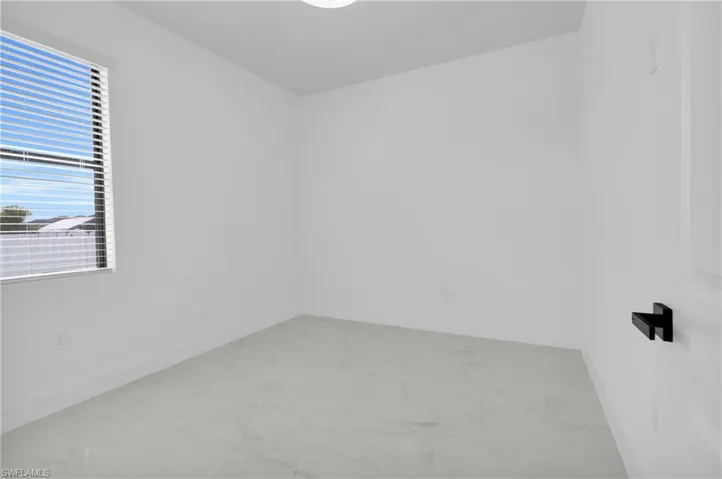 Hall with baseboards and light marble finish flooring