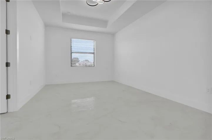 Full bath with double vanity and a shower stall