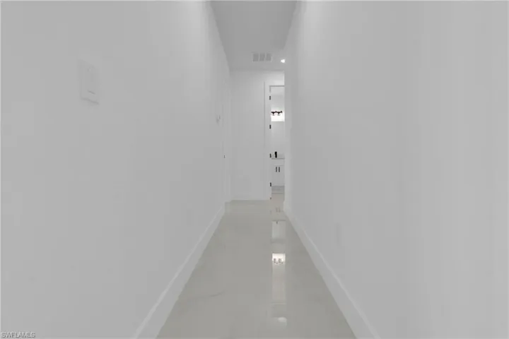Unfurnished room featuring baseboards