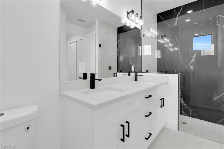 Spare room with baseboards and light marble finish floors