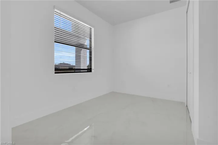 Unfurnished room with baseboards