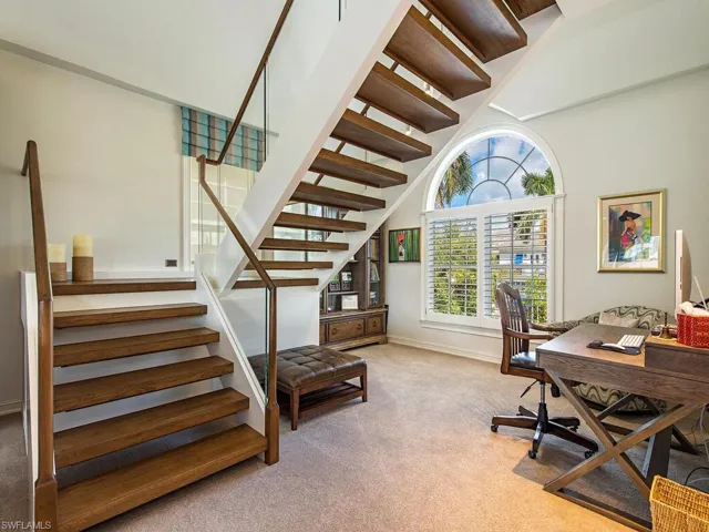 Beautiful glass railings and convenient area for a desk