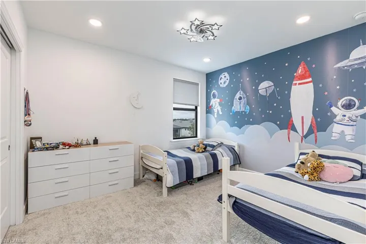 Bedroom featuring carpet and recessed lighting