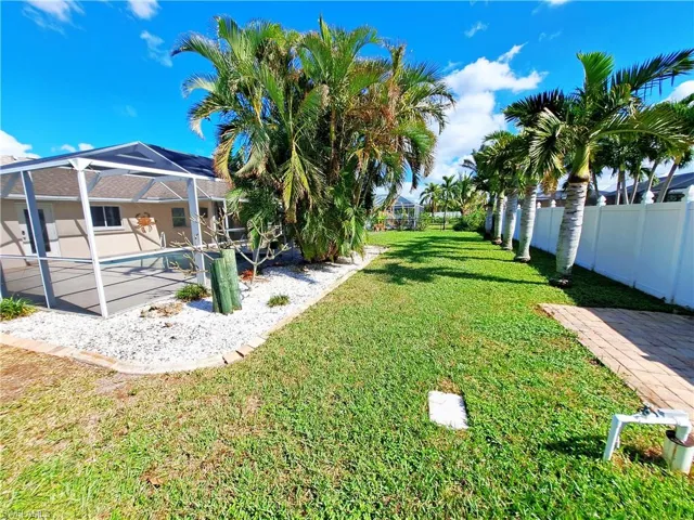 View of yard with a lanai and a patio