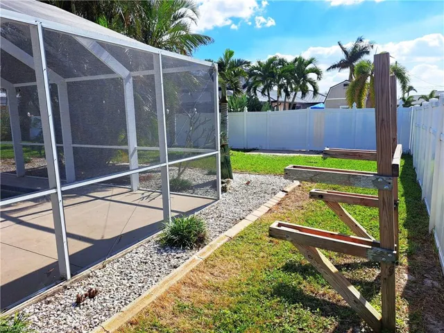 View of yard with a lanai