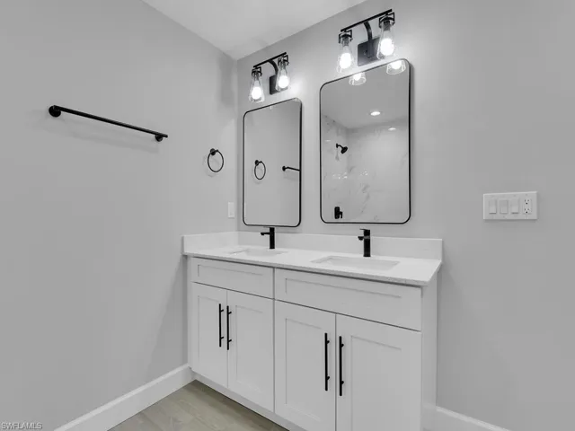 Bathroom with vanity and a shower