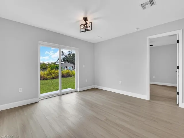 Spare room featuring light wood-type flooring