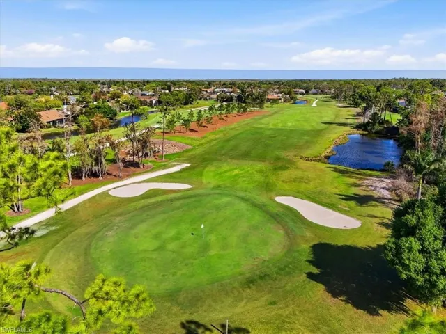 Bird's eye view of a nearby body of water and a golf club