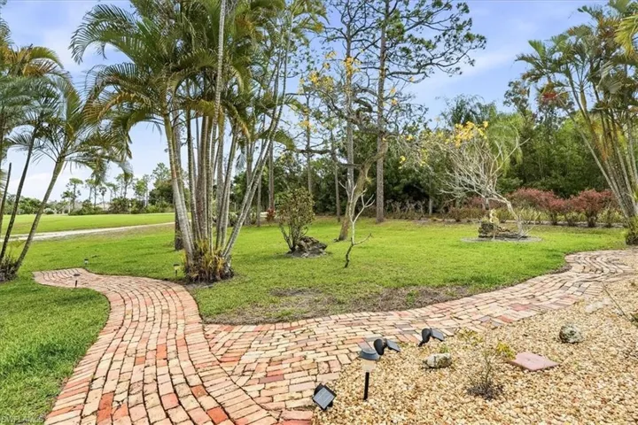 Bird's eye view of a nearby body of water and a golf club