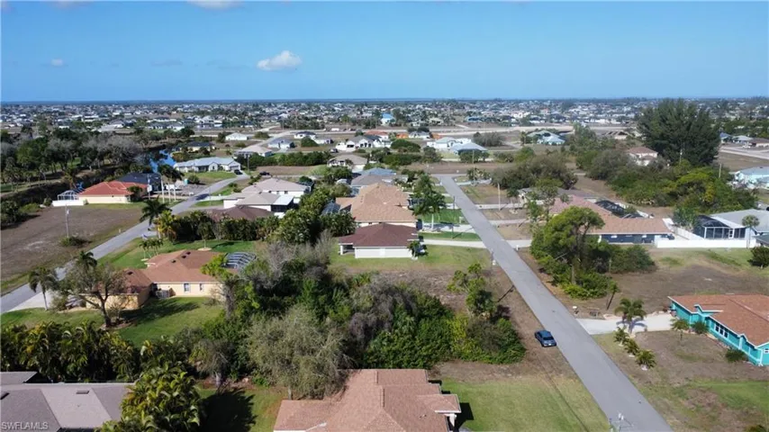 Aerial overview of property's location with nearby suburban area