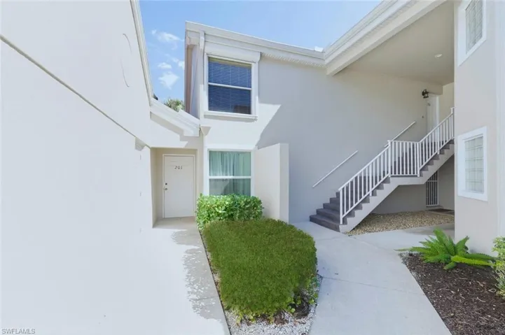 Doorway to property with stucco siding