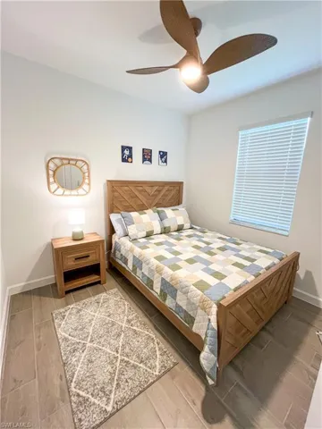 Bedroom with tile finished floors and a ceiling fan