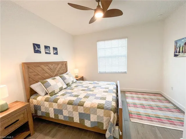 Bedroom with tile finished floors and a ceiling fan