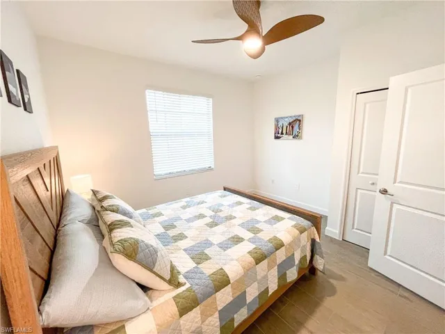 Bedroom with tile finished floors and ceiling fan