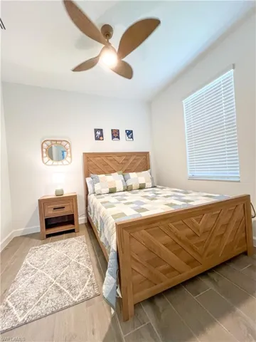 Bedroom featuring tile finished floors and a ceiling fan
