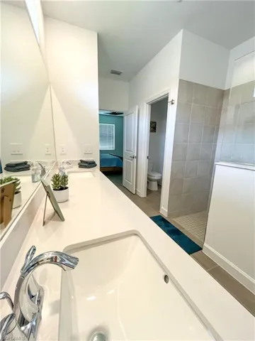 Bathroom with walk in shower and double vanity