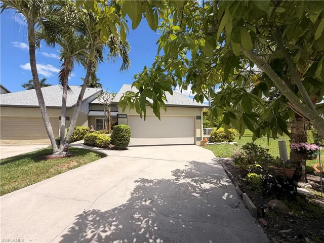 Long drive way beautifully landscaped
