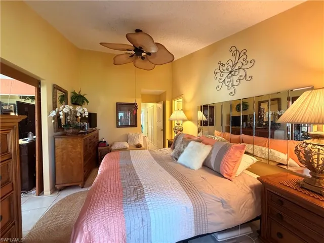 Primary BR leading to Great Room via wooden Plantation Sliders