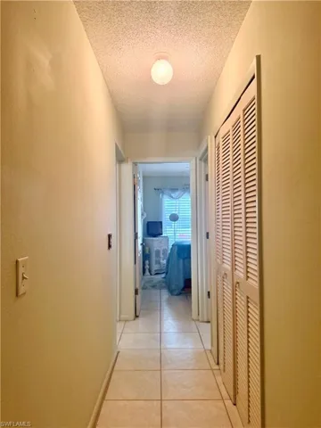 hallway with huge linen/storage closet in between bedrooms