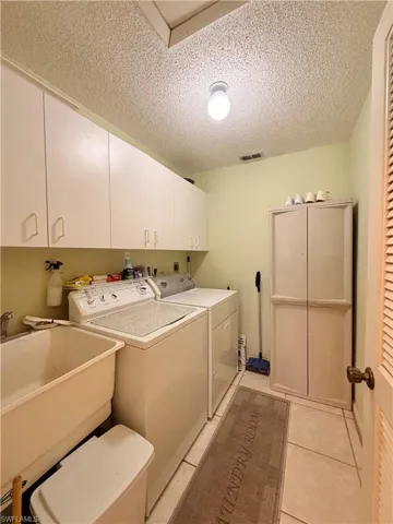 Laudry room to right of entrance leading towards garage
