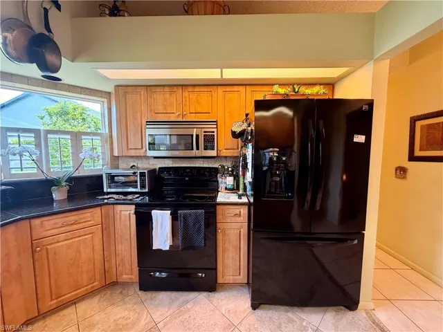 Enter Kitchen and Open LR/Great Room to left of entrance
