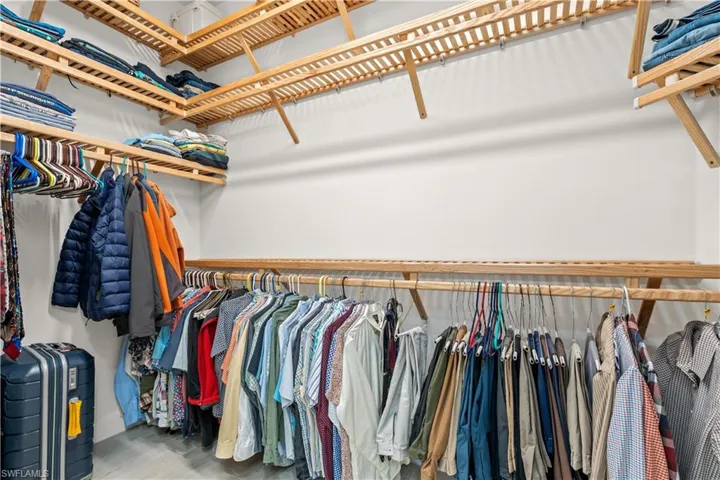 Walk in closet featuring wood finished floors