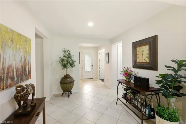 Entryway featuring light tile diagonal flooring and recessed lighting