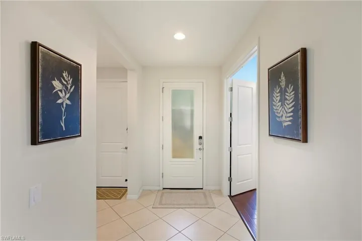 Entrance foyer featuring light tile diagonal floors