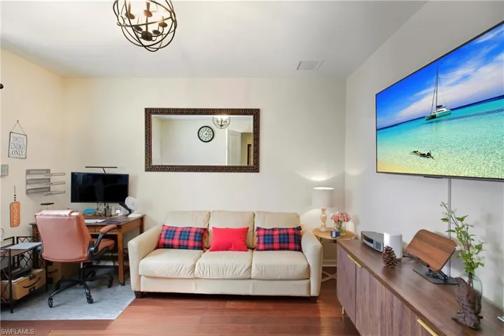 Office space featuring wood style tile floors/bedroom