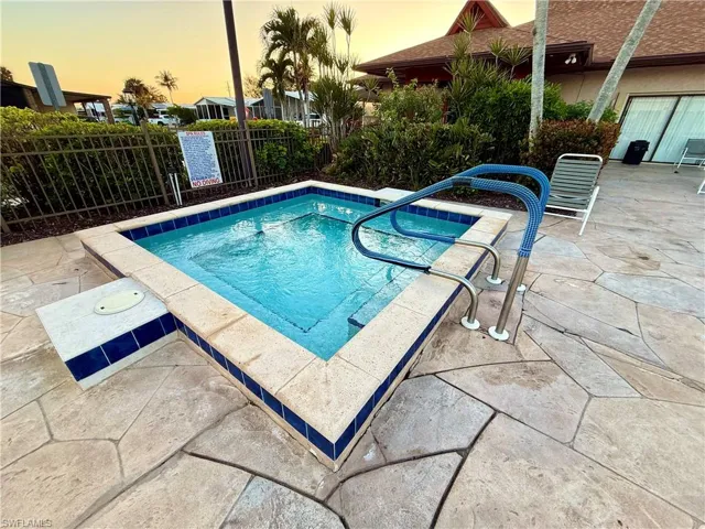 Pool at dusk with a patio