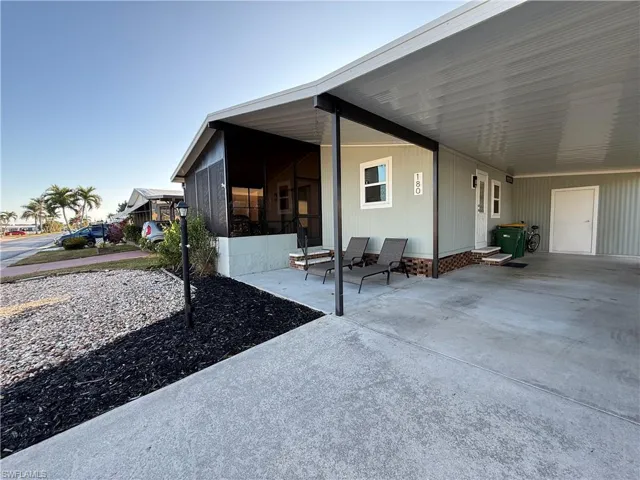 View of home's exterior featuring a carport