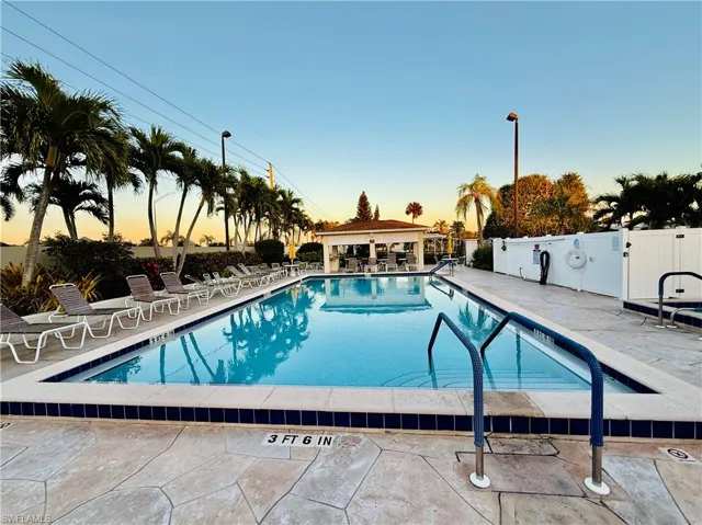 Pool at dusk with a patio