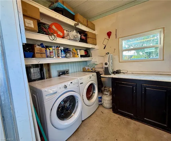 Storage room with washing machine and dryer